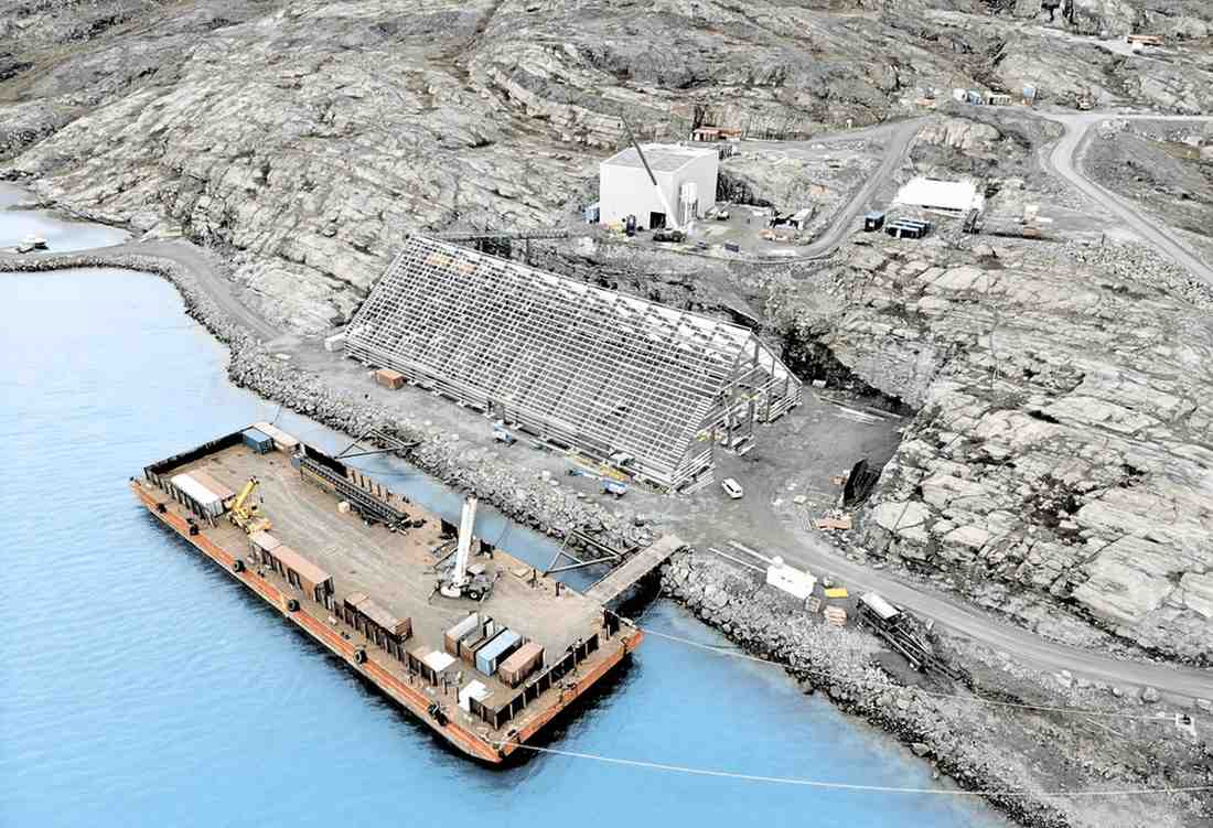 A durable pre-engineered steel structure being built in a remote mining location, designed for extreme weather conditions.